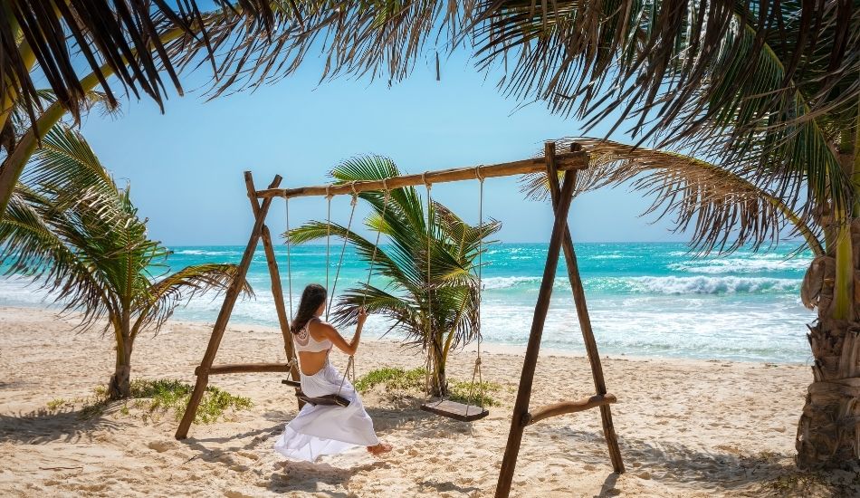 Boho-chic lifestyle in Tulum by the beach swing