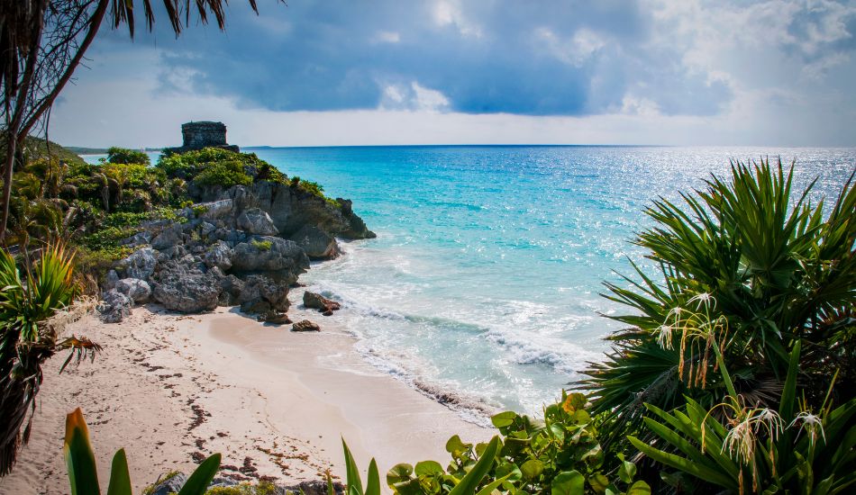 tulum beach lifestyle with turquoise water and jungle surroundings near top real estate areas