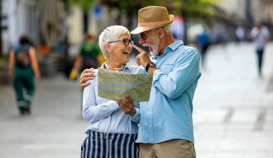 couple reviewing map while planning where to buy property in tulum
